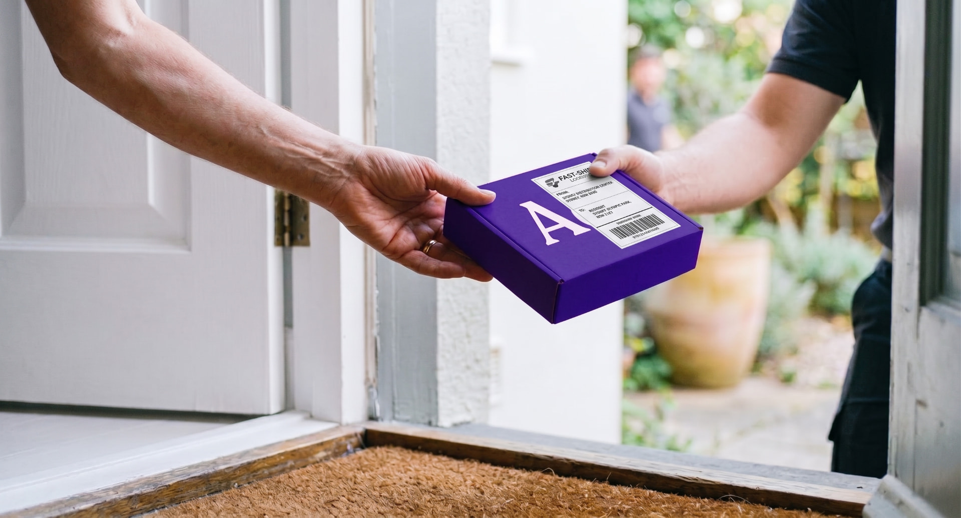 A parcel with specialty medication being handed to a patient at home