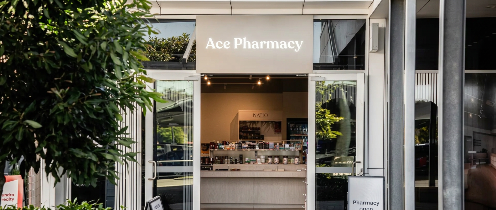 A pharmacist advising a patient across a pharmacy counter